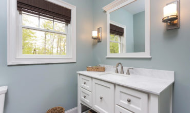Custom Vanity with Framed Mirror by Walpole Cabinetry
